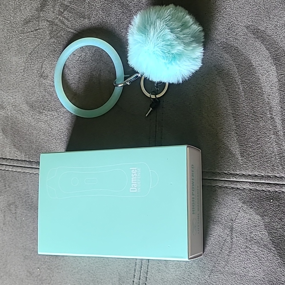 Brand new Taser comes with wristlet